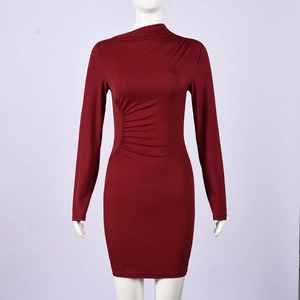 Detailed close-up of the pleated waist design on a wine red bodycon evening dress