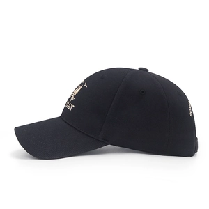 Unisex black baseball cap with gold embroidery featuring curved brim and cotton fabric