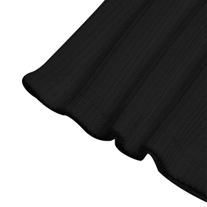 Close-up of black waffle knit fabric showing detailed vertical ribbed texture and patterns