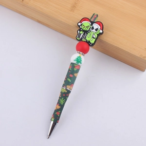 Detailed view of Christmas silicone beaded pens featuring Grinch and Jack Skellington motifs