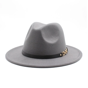Detail of grey felt fedora featuring a black leather band and gold metal chain buckle