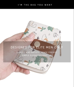 Detail of cream short wallet with cartoon dinosaur prints and secure metal snap closure