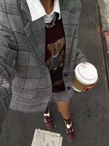 Women's grey plaid blazer and skirt set with burgundy bear sweater and sneakers