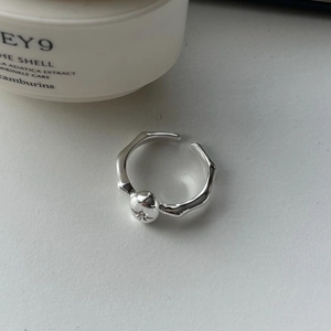 Minimalist 925 sterling silver open ring with organic shape and engraved star detail