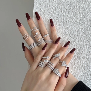 Close-up of S925 sterling silver rings with multi-layer heart and snake designs