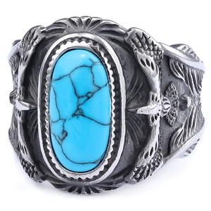 Vintage silver ring with oval blue turquoise and engraved eagle feather patterns