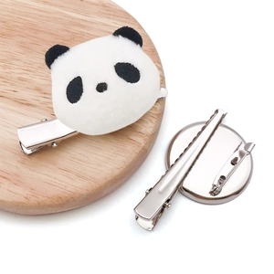 Cute plush panda hair clip with embroidered features and secure metal duckbill clip back