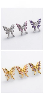 Macro shot of titanium steel butterfly ear studs with colorful marquise zircon inlays