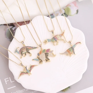 Set of 5 hip hop gold dinosaur necklaces with colorful cubic zirconia on shell tray