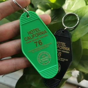 Detail of vintage plastic Hotel California key tags in green and black colors