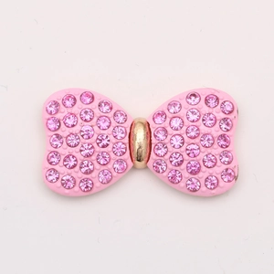 Pink rhinestone bow accessory with gold metal ring for DIY jewelry and crafts