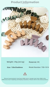 Detailed size chart for matte wavy claw clips in brown and grey colors on a woven mat