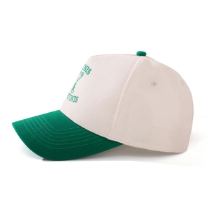Detail shot of embroidered tennis and martini design on two-tone cotton baseball cap