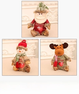 Detail of Christmas gift bags featuring Santa, Snowman, and Reindeer with clear heart windows