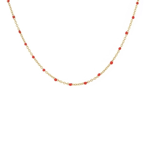 Minimalist gold link necklace with vibrant red bead accents on a clean white backdrop