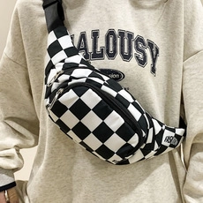 Close-up of checkerboard waterproof waist bag featuring black fashion label and zipper