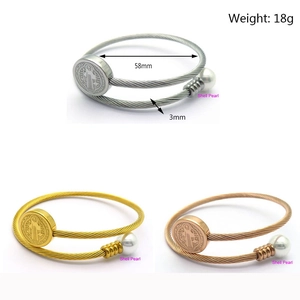 Adjustable stainless steel cable bracelets with shell pearls and St. Benedict medals