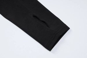 Detail view of high-elastic black yoga top cuffs featuring functional thumbholes