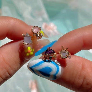 Cartoon astronaut space theme earring set featuring gold plating and pastel gemstones
