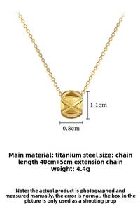 Detail view of gold titanium steel cylinder necklace with quilted texture and dimensions