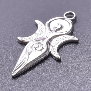 Detailed macro view of a polished silver stainless steel Triple Moon Goddess charm