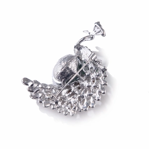 Detailed back view of silver alloy peacock brooch showing secure pin fastener mechanism