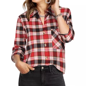Detail of red and black plaid long sleeve shirt showing chest pocket and button-down collar