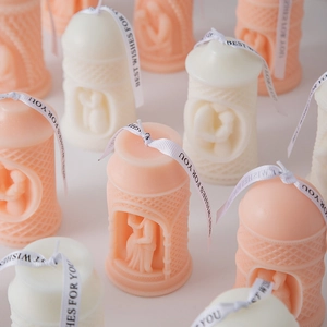 Detail of pavilion pillar candles with romantic couple relief and Best Wishes ribbons