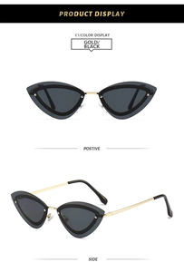 Cat eye sunglasses with golden metal frames and black lenses from front and side view