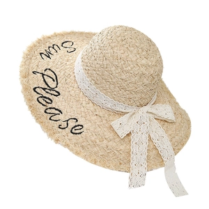 Beige raffia sun hat with white lace ribbon and Sun Please embroidery on wavy brim