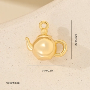 Macro shot of gold teapot pendant with 1.3x1.2cm size and 3.9g weight details