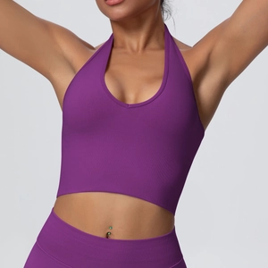 Macro detail of purple ribbed fabric on halter neck seamless sports bra and leggings