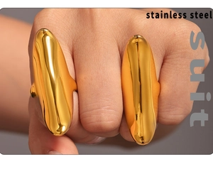 Polished golden stainless steel double-finger ring on model hand detail view