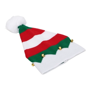 Detail of a striped Christmas elf hat with golden bells and a white fluffy pompom