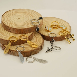 Minimalist stainless steel earrings set featuring wing, cross, and butterfly charms