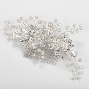 Silver alloy bridal hair comb with handmade pearls and rhinestone flowers on white background