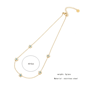 Detailed view of stainless steel gold chain with five blue evil eye flower pendants