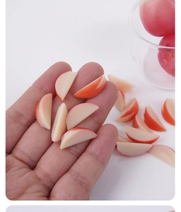 Detailed view of 2cm miniature apple slices with red peel and realistic flesh texture