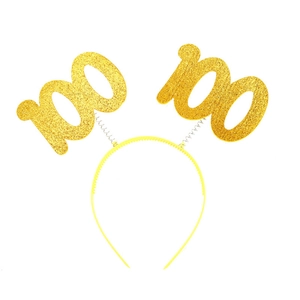 Detail of glittery gold '100' numbers on a yellow plastic headband for celebrations