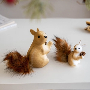 Realistic sisal squirrel ornaments with faux fur tails and pine cones for Christmas decor