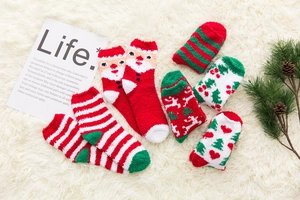 Close-up of fluffy Christmas socks featuring Santa and reindeer on white plush background