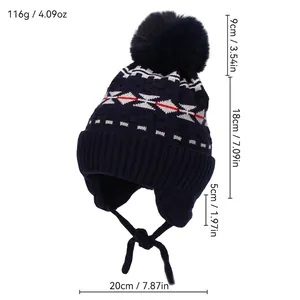 Winter boy knit beanie with geometric jacquard pattern, earflaps and faux fur pompom