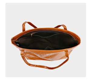 Interior view of crocodile embossed tote bag showing spacious room and zipper pocket