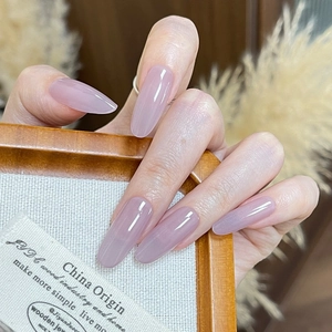 Lavender purple cat eye press-on nails with a translucent jelly finish and oval shape