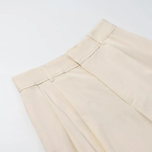 Pantaloni a gamba larga con pieghe a vita alta da donna in beige con drappeggio