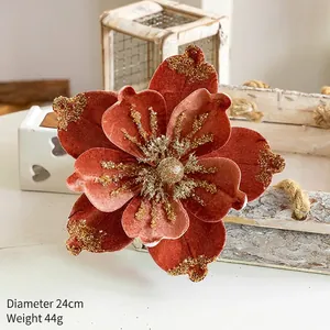 Detail of 24cm rust red velvet Christmas flower with gold glitter edges and center