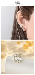 Close-up of geometric coffee gold earrings with sparkling zirconia inlays for a luxury look