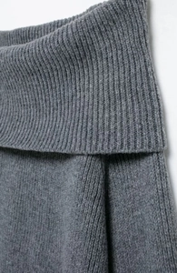 Macro shot of gray ribbed knit fabric texture and fold-over collar on an off-shoulder top
