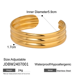 Detail view of golden stainless steel multi-layer cuff with exact size measurements