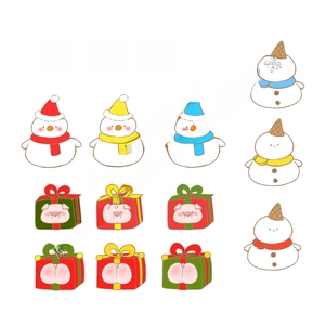 Flat lay of Christmas resin snowman figures and festive pig gift box decorations